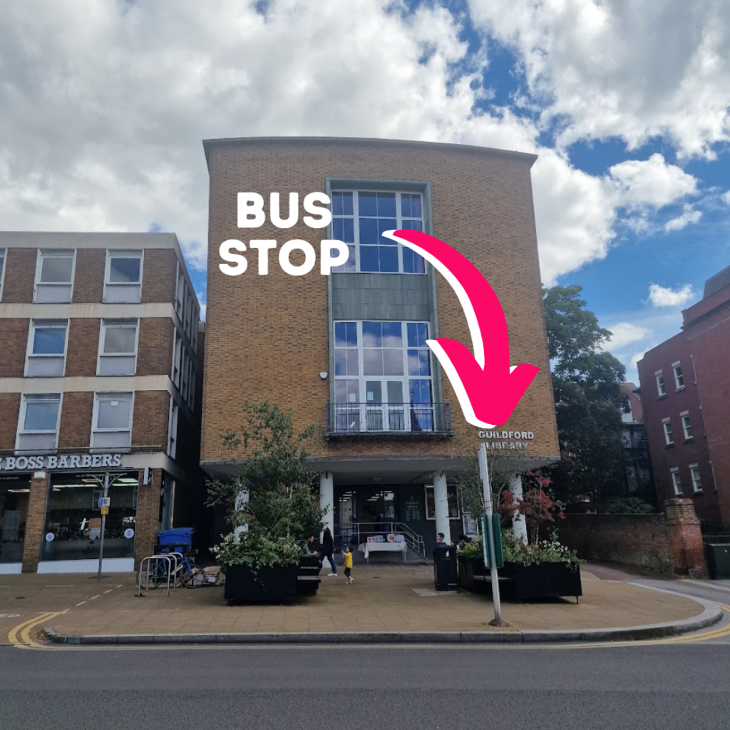 A picture of the bus stop directly outside Guildford Library